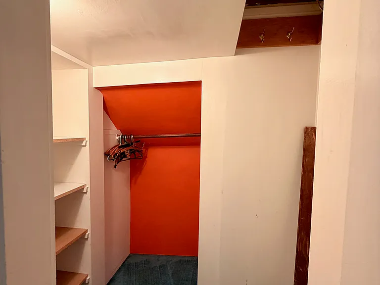 Downstairs side bedroom closet.