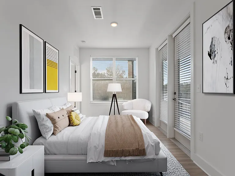 A bright bedroom with space to unwind and reset
