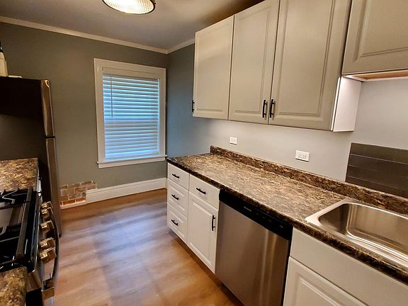 Renovated Kitchen:: New Gas Range & Refrigerator/Freezer, Range Hood & Fan, Accent & Countertop Lighting, Cabinetry & Countertops, Dishwasher, Double Sink, Surround Backsplash Cork Underlayment Flooring, Window Treatments, New Elect