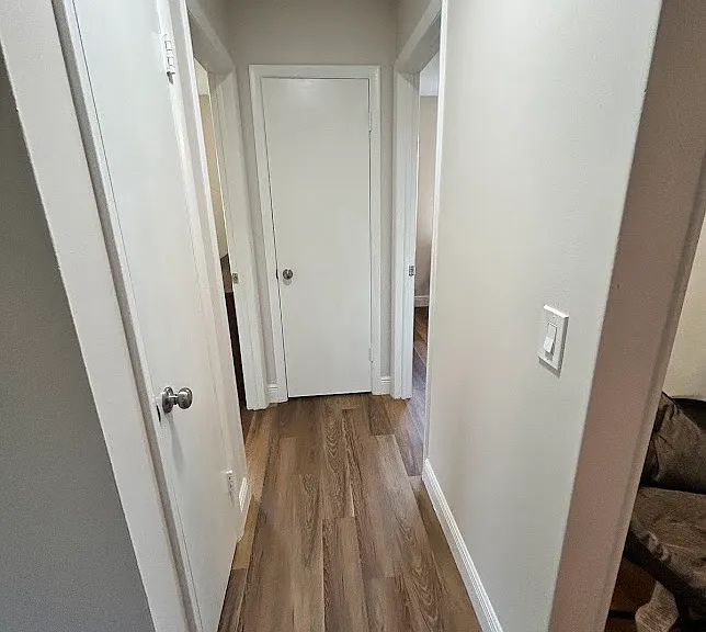 Hall between rooms, linen closet, coat closet
