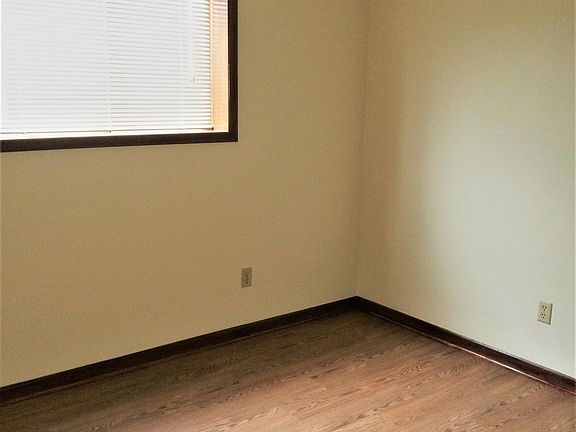 Bedroom with window view and ceiling fan