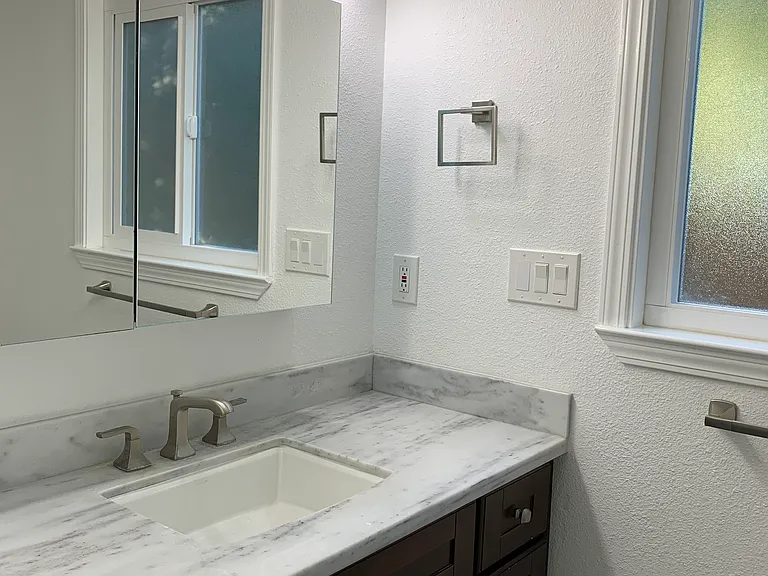 Upgraded primary bathroom with dual-sink vanity