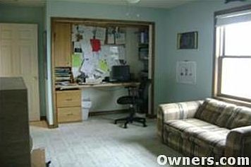 This picture diplays the den with built in desk.