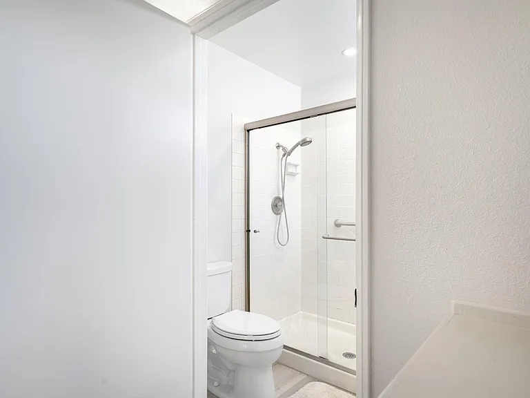Spacious bathroom with stand-up shower stall
