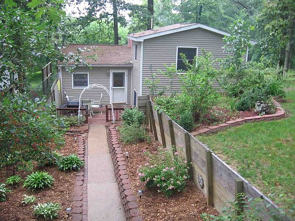 Front of the house, looking down from the gararag, which the house sits behing