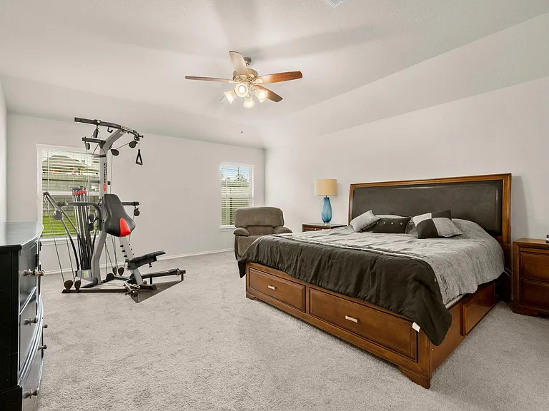 MASTER BEDROOM, OVERLOOKING THE GREEN BACK YARD