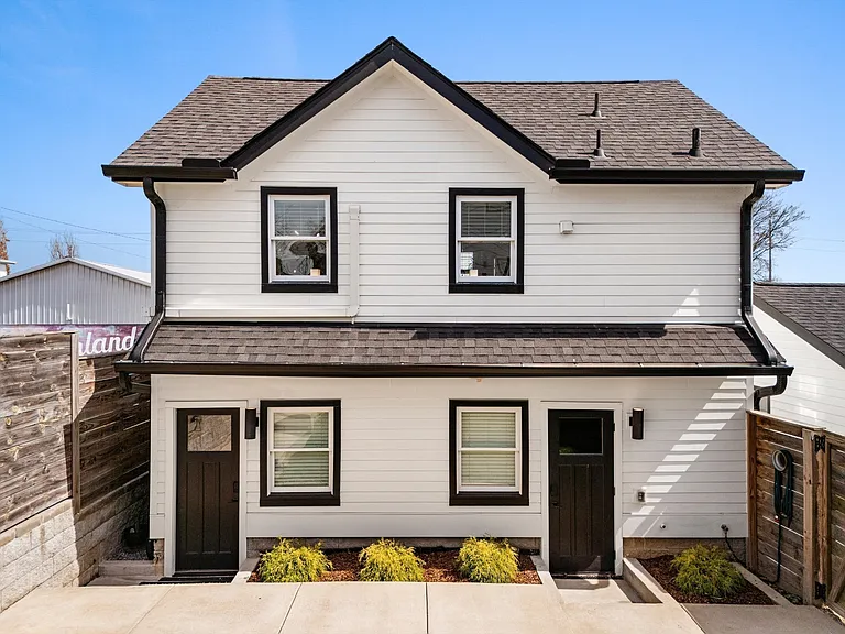 Detached studio with private entrance above the two-car garage.