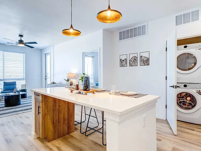 Enjoy thoughtfully designed living with an open-concept layout, oversized kitchen island, and convenient in-home washer and dryer.