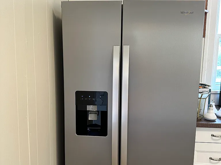 Refrigerator has water in the door feature