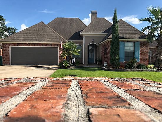Beautiful curb appeal with palms