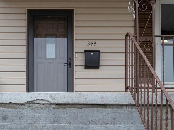Simple Elegance through the doors of your covered front porch.