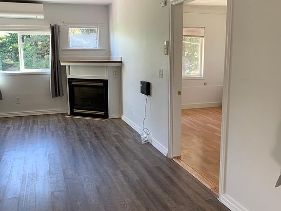 Living room with bedroom to the right