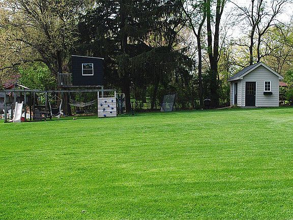 Back yard; swingset; potting shed; kids' playhouse