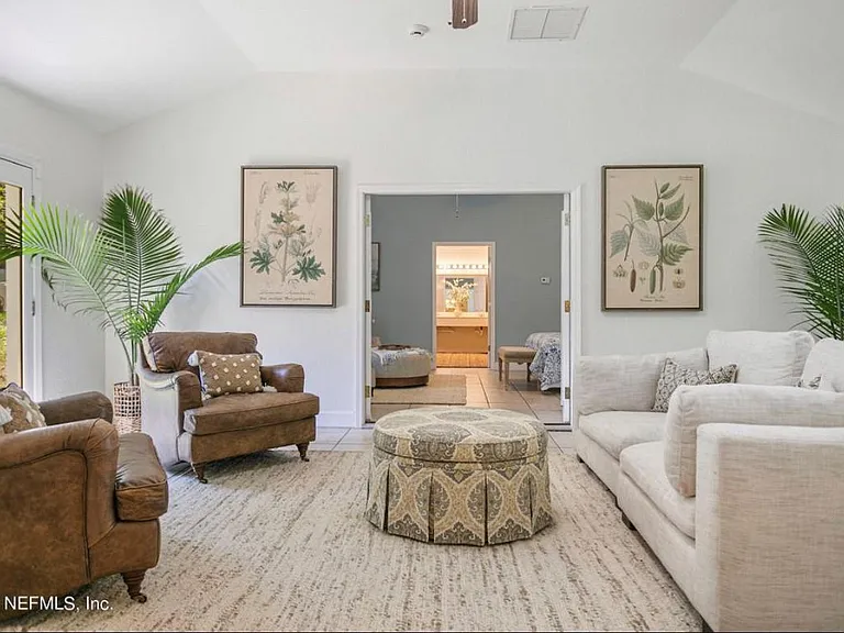 Bonus living room (back of the house). Includes exterior doors to backyard and front yard.