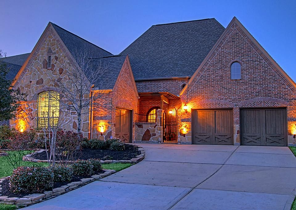 Welcome home to 18 Kayak Ridge, a sophisticated 1.5 story patio home with 3-car garage!