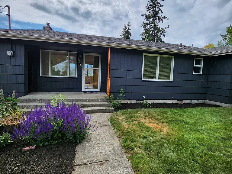Previous picture and this picture of the entryway in the spring. More flowers have sprung up now, visible in upcoming pictures.