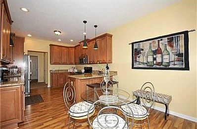 Breakfast Area/Room. The cozy breakfast room and breakfast bar area add informal seating.