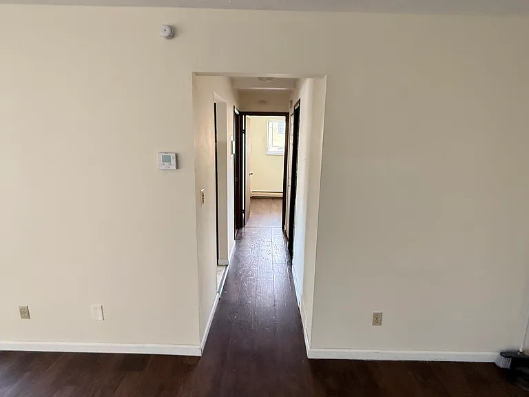 Living room view into hallway and bedroom. .