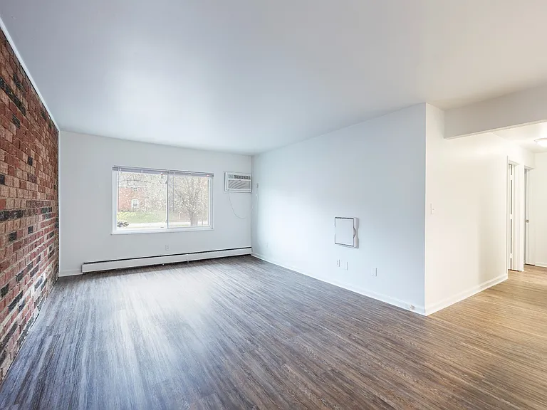 Spacious Living Room with Brick Wall