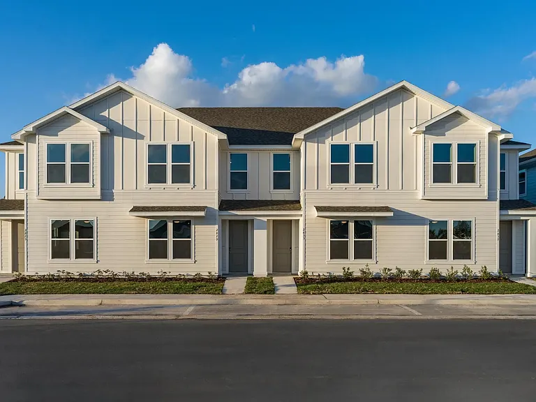 These spacious townhomes feature three bedrooms and attached garages, providing plenty of space for residents to spread out and relax.