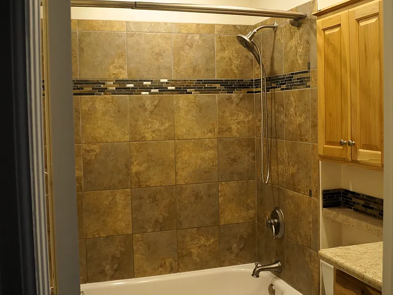 Main bathroom. Tile floor and tub & shower walls. New Heater/Fan/Light.