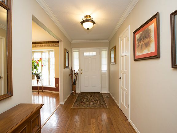 Entry has Wood Floors & Crown Molding