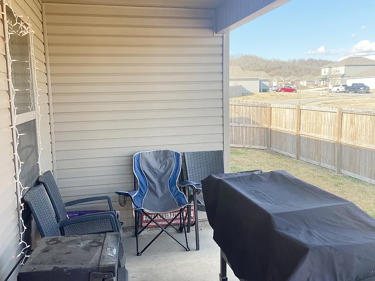 Great covered patio with privacy fence backyard.