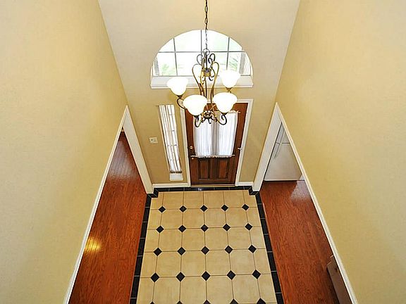 ENTER TO SOARING TWO STORY CEILINGS