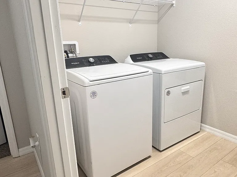 Laundry room with washer and dryer included