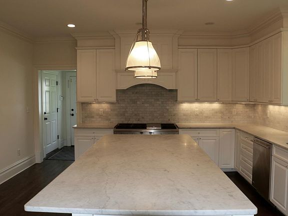 kitchen with GE Monogram stainless steel appliances, subzero