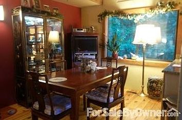 Breakfast room
						:
						Just over the L shaped counter view of trees and woods out the large window.