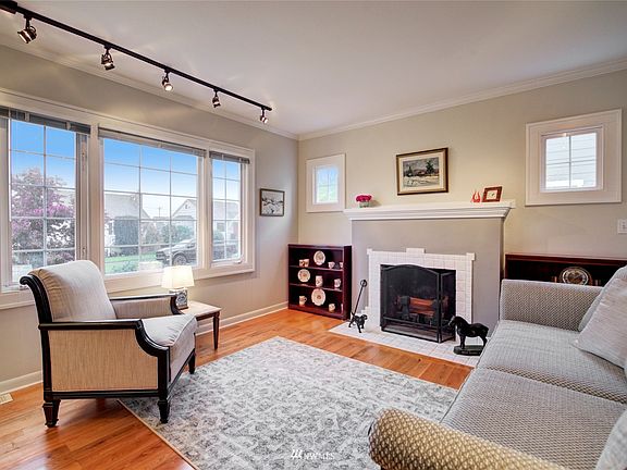 Charming living room with wood burning fireplace