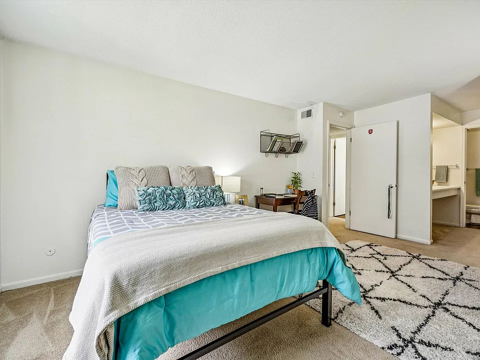 Rest comfortably in a cozy bedroom with a walk-in closet and private bathroom at University Hills Apartments near the University of Toledo.