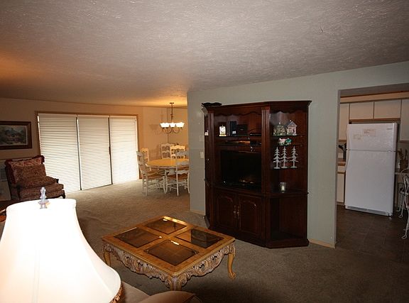 Open floor plan and entertainment center featuring a variety