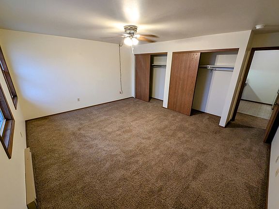 Large bedroom facing closets