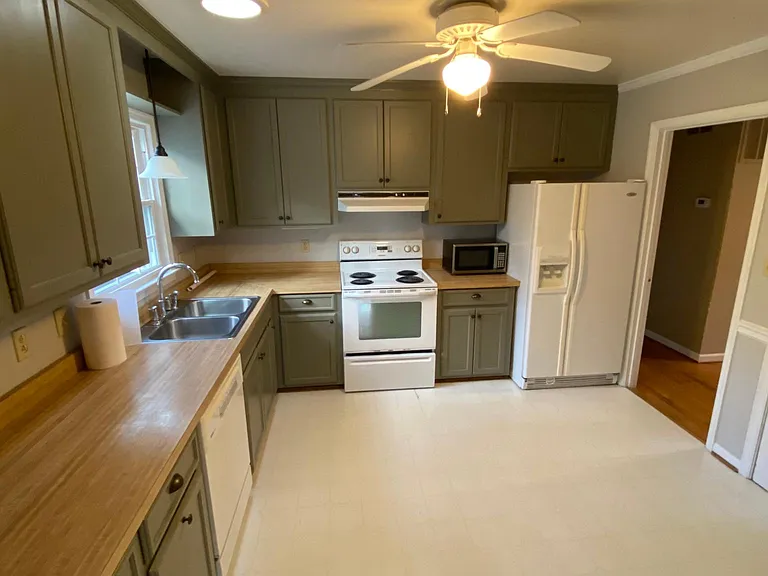 Kitchen: Updates coming before new lease are Countertops, Faucet, Sink, and Flooring.