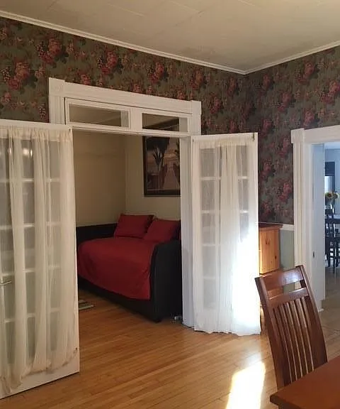 Looking into the main floor bedroom/office from the dinning room