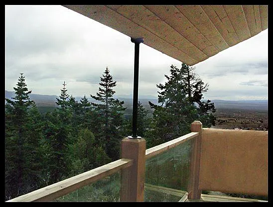 The upper balcony off the main bedroom looking southwest on a cloudy day.