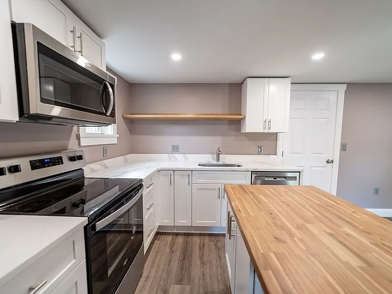 Beautiful newly restored kitchen/shared room, modern appliances and butcher block island!