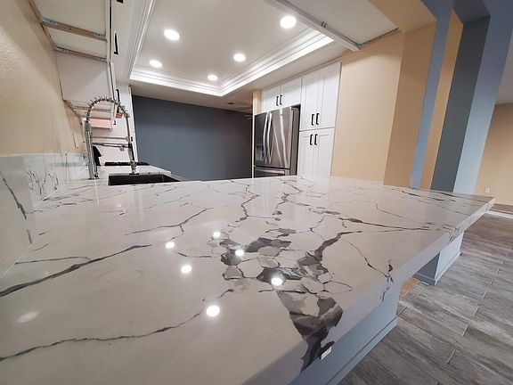 Brand new grey-veined white quartz countertops