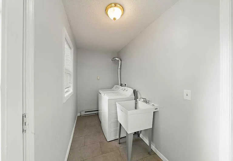 Main level washer/dryer, sink. Access to backyard and garage.
