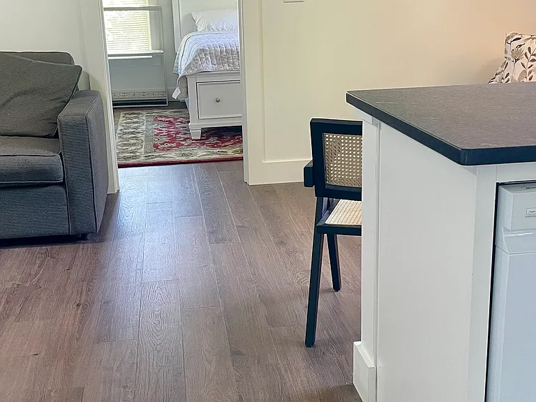 From the front door, the kitchen is on your right, bedroom straight ahead and living room area on the left.