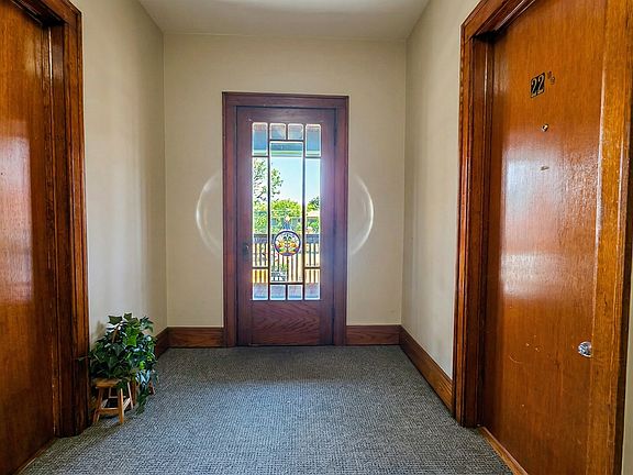 Entrance to Unit on the right and shared porch
