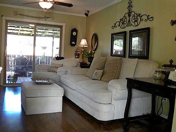 LIVING ROOM HAS PERGO FLOORS AND CROWN MOLDING