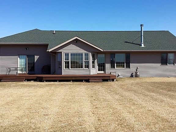 Back of the house with deck