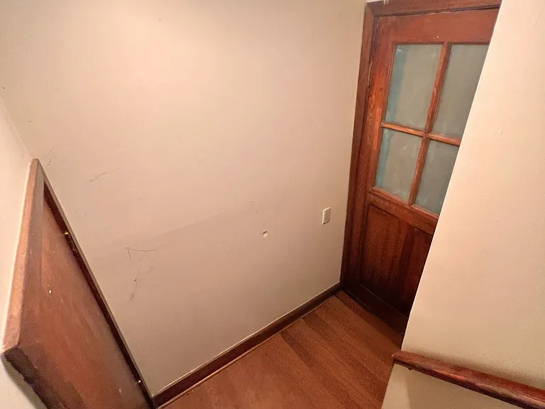 Extra storage by the entrance. The doors are permanently closed.