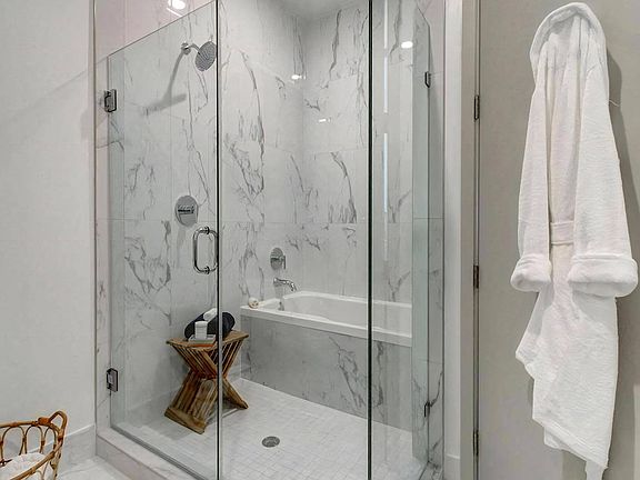 Luxury Bathrooms with Oversized Soaking Tubs & Frameless Glass Shower Enclosure