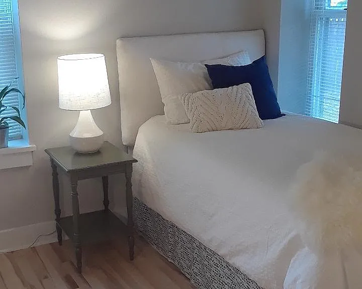 The third bedroom, in the North West corner has two windows and can be arranged two ways.