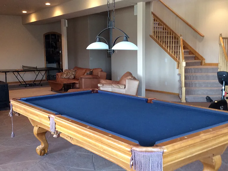 Pool table in full finished basement.