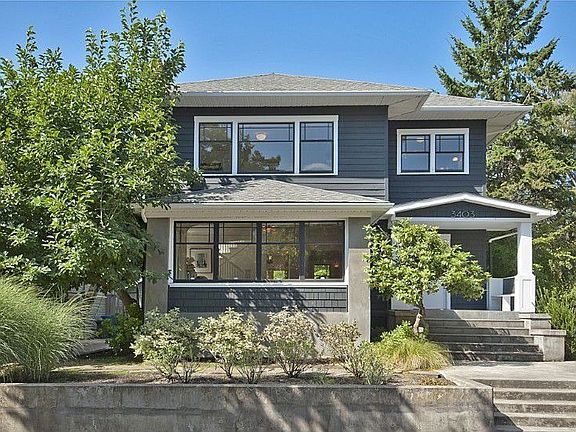With walls of east and west facing windows, this home is extraordinarily bright and is located across the street from the Boulevard. Classic craftsman style with a modern twist, poured concrete retaining walls and modern landscaping.